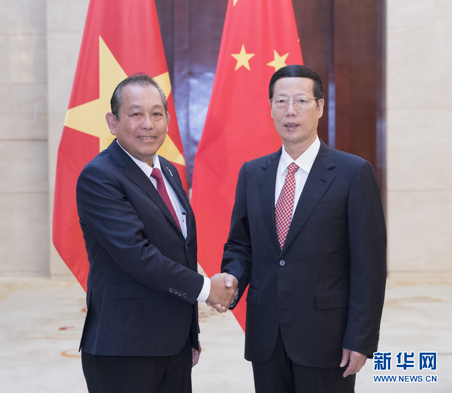  9月11日，中共中央政治局常委、國務院副總理張高麗在廣西南寧會見前來出席第十四屆中國－東盟博覽會和中國－東盟商務與投資峰會的越南常務副總理張和平。新華社記者王曄攝